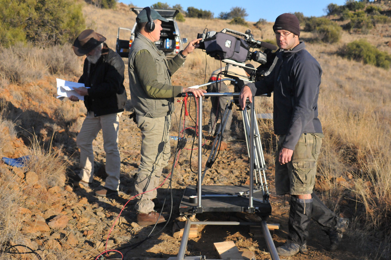 Shane Mahoney, the main narrator, Theo Pretorius, director/DOP and Justin Van Zyl, grip, preparing to film part of the documentary on the slopes of the Rooiberge (Red Mountains) on Bankfontein in the Karoo.